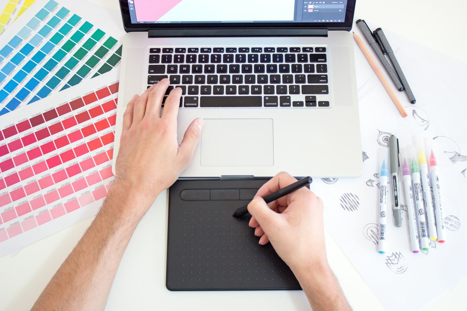 Designer building a Figma Motion animation on a laptop