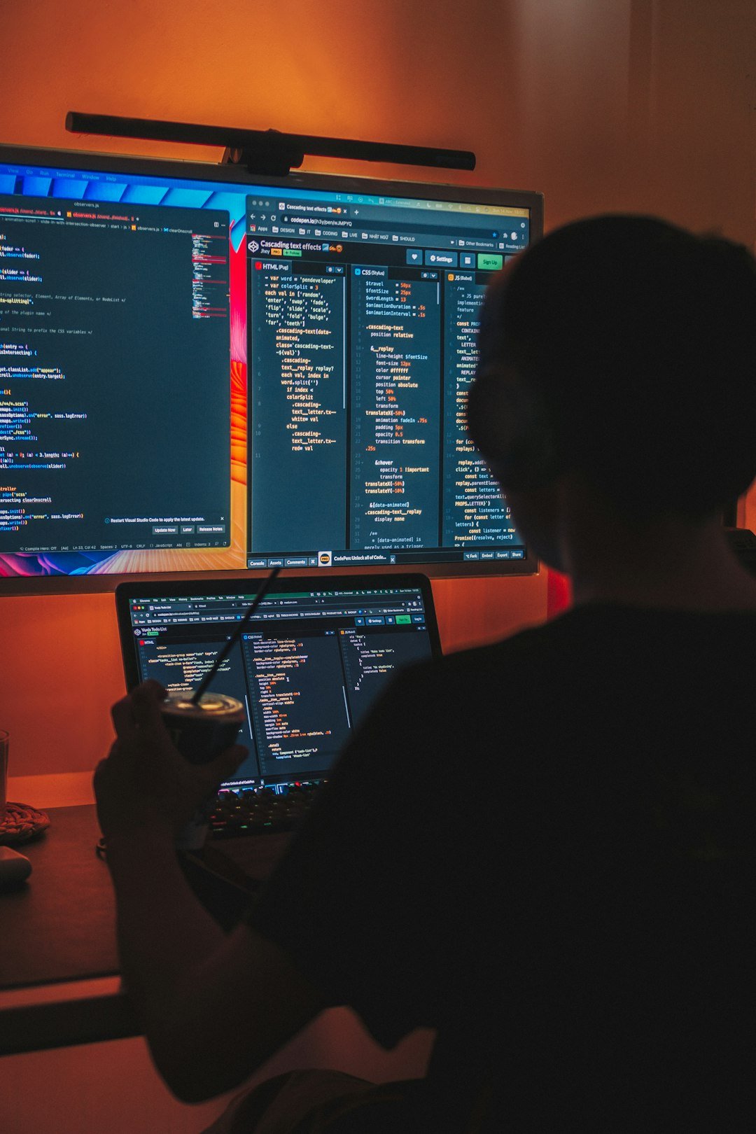 Claude Sonnet 5 pricing Developer working at a dual-monitor desk, budgeting Claude Sonnet 5 pricing for a coding agent