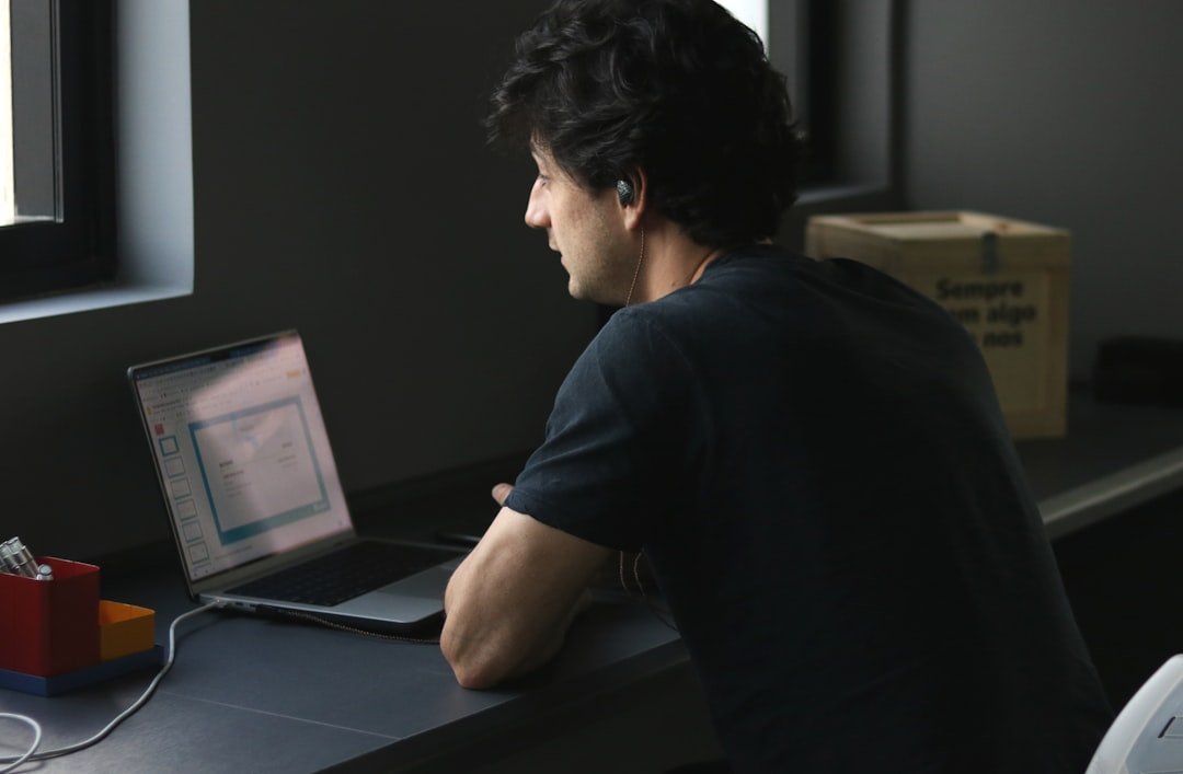 Elementor Pro vulnerability Developer patching the Elementor Pro vulnerability on a laptop
