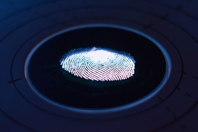 passkeys vs passwords biometric fingerprint scanner representing phishing-resistant login security