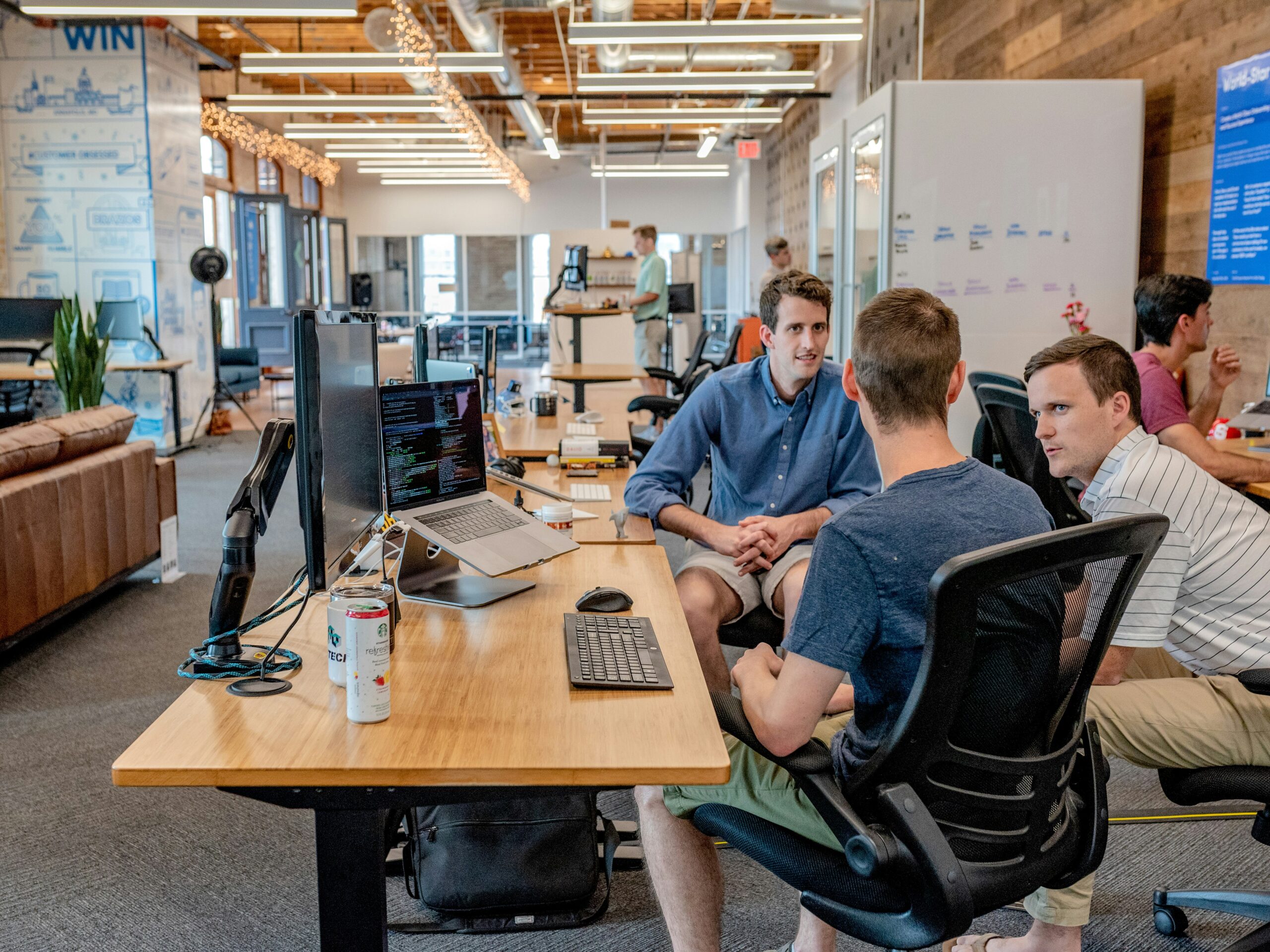 Small business team reviewing an AI agent workflow on a laptop dashboard