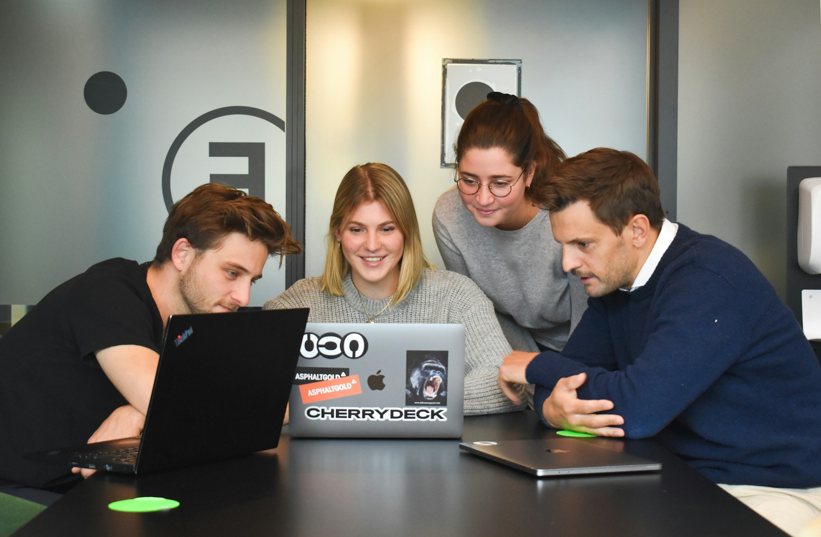 Canva AI 2.0 Team collaborating on a Canva AI 2.0 design project on a laptop
