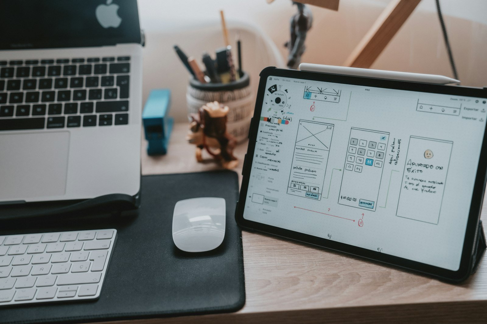 UX design trends 2027 designer workspace with wireframe screens