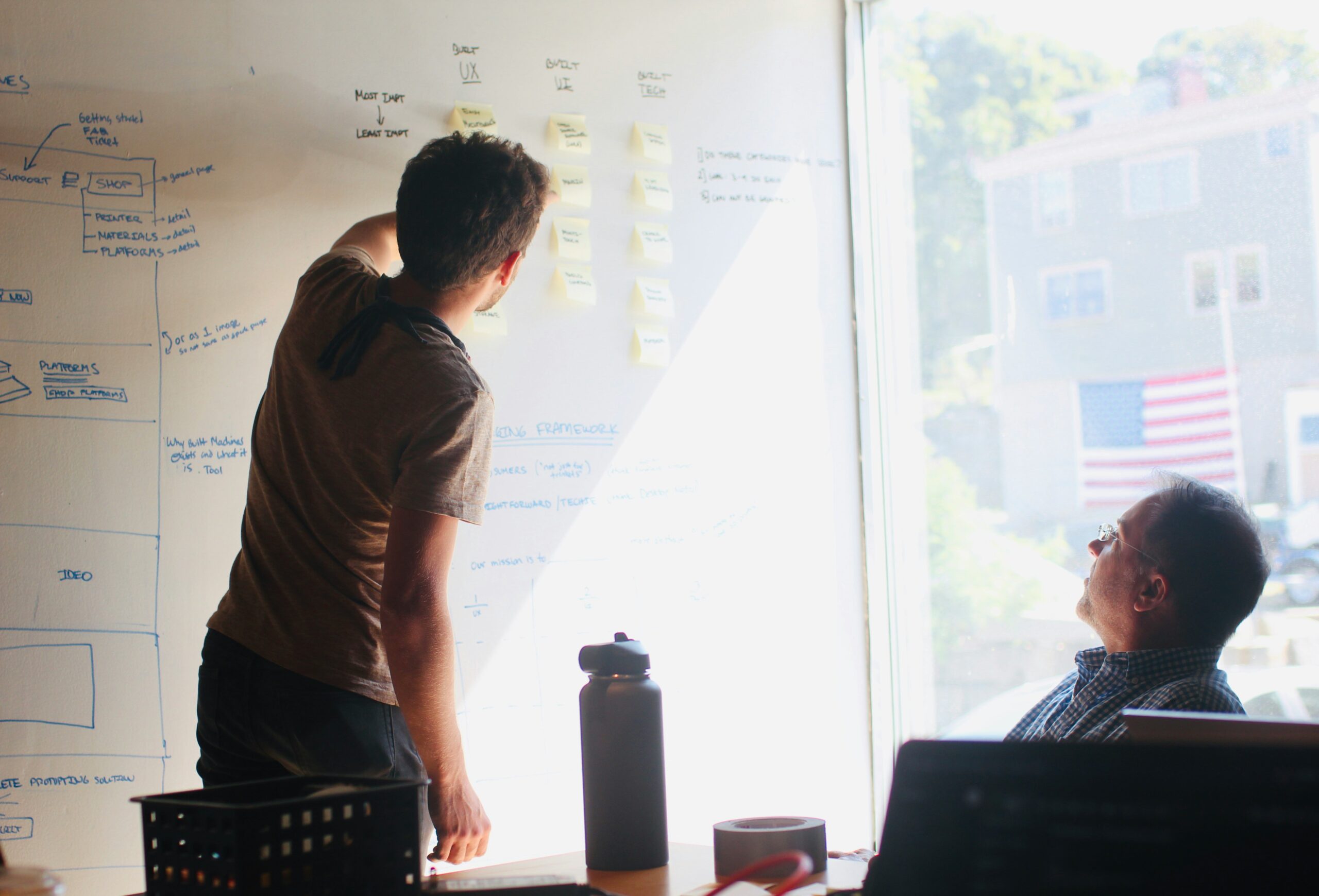 Canva vs Figma team reviewing a UI wireframe during a design handoff meeting
